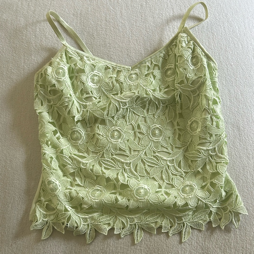 Top mint green lace back has stretch material, bra build in size S